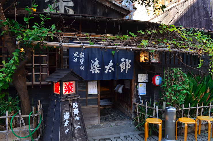 The exterior of Sometaro gives some clue as to the legacy it holds; a rustic timber structure with a bamboo fence and a tall, leafy tree.