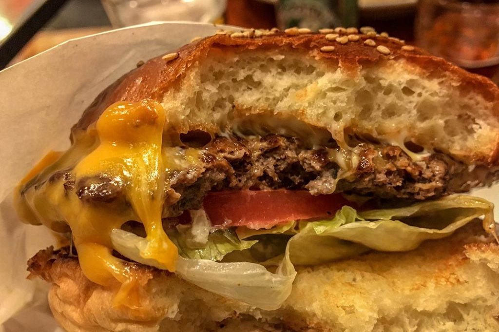 The Cheeseburger has all the key elements such as iceberg lettuce, thick sliced tomato, delicious Aussie beef patty and melted cheese.