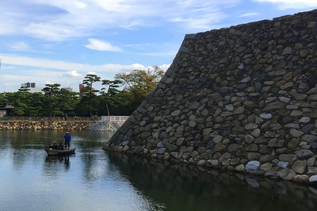 Visitors can boat through the moat of Takamatsu Castle