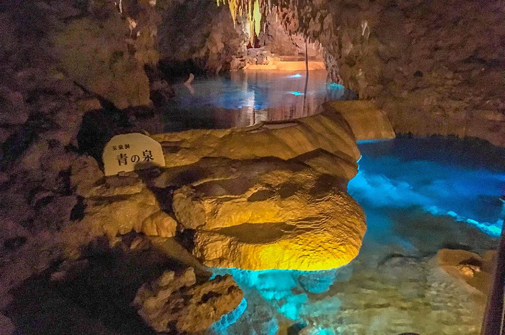 The lighting in Gyokusendo enhances the colors of the stone and water. 