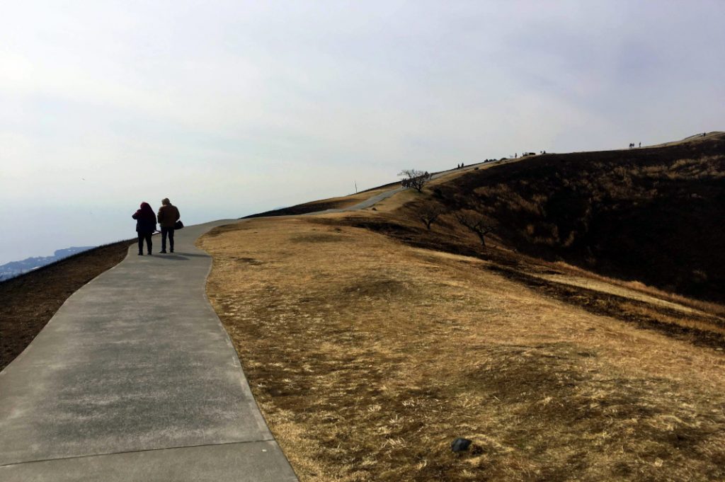 The walking trail winds around the Mount Omuro's rim.