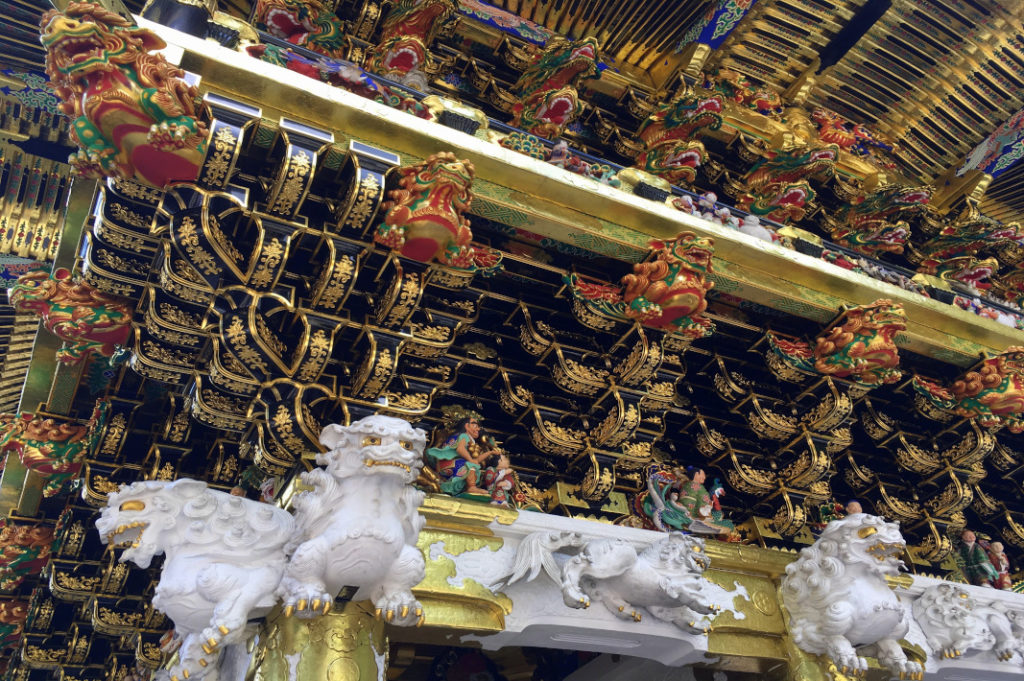 Fierce dragons guard this gate at Nikko Toshogu Shrine.