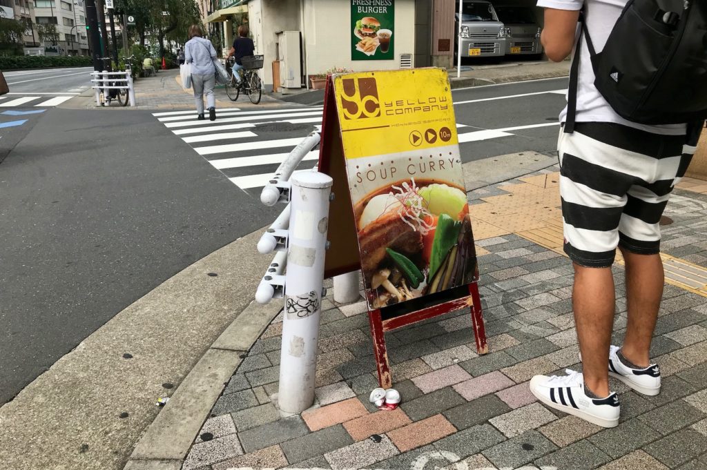 Follow the yellow sandwich board