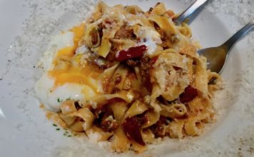 Superb Slurps at street pasta company adding an egg to your pasta
