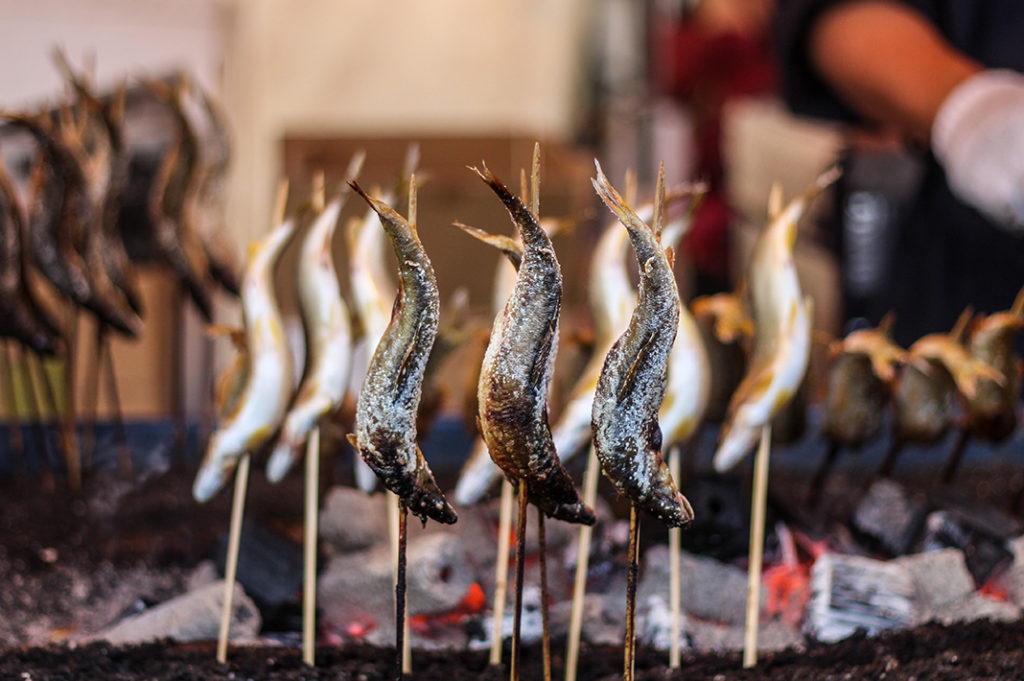 Ayu fish grilled over charcoal: a festival staple. 