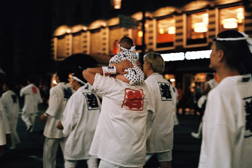 Traditional gender roles define the duties of people participating in the matsuri - no man is too young to do his part.