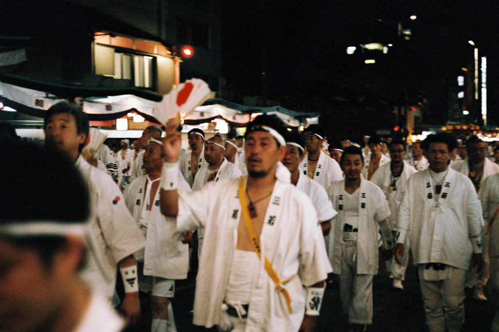 Men in their thousands representing the historical clans, families and districts of Kyoto spill onto the streets during Gion Matsuri.