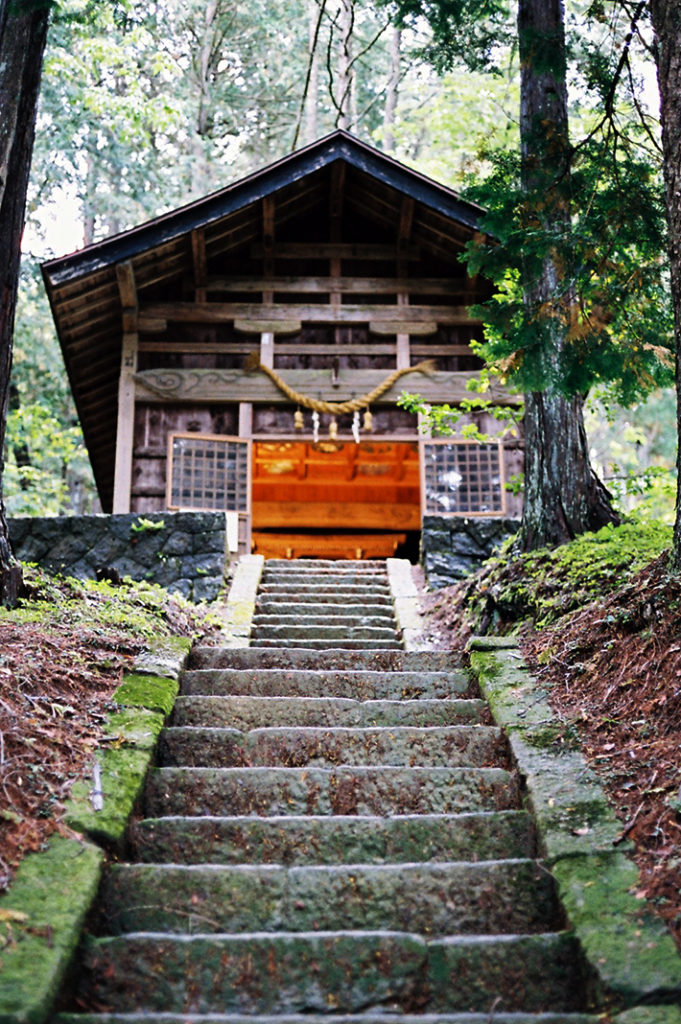 At the rear of Hida Folk Village is a shrine decorated with exquisitely painted ceiling motifs.