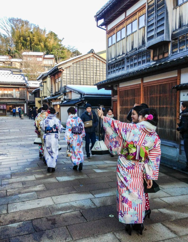 Not geishas, just friends posing for photos wearing kimono in Higashi Chaya