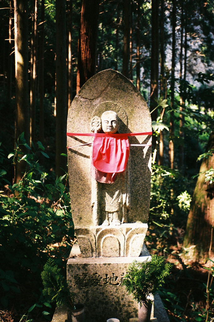 A statue of Jizo-sama; one of many which line the ascent to the top of Hozan-ji's expansive grounds.
