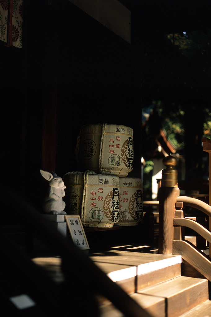 A common sight at Shinto shrines: stacks of 'Gekkeikan' sake barrels, made locally at a famous Fushimi-based brewery.