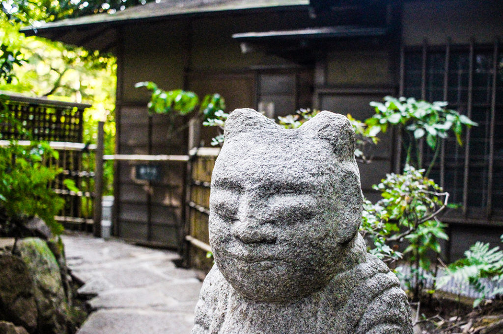 Statue outside a tea house in the garden