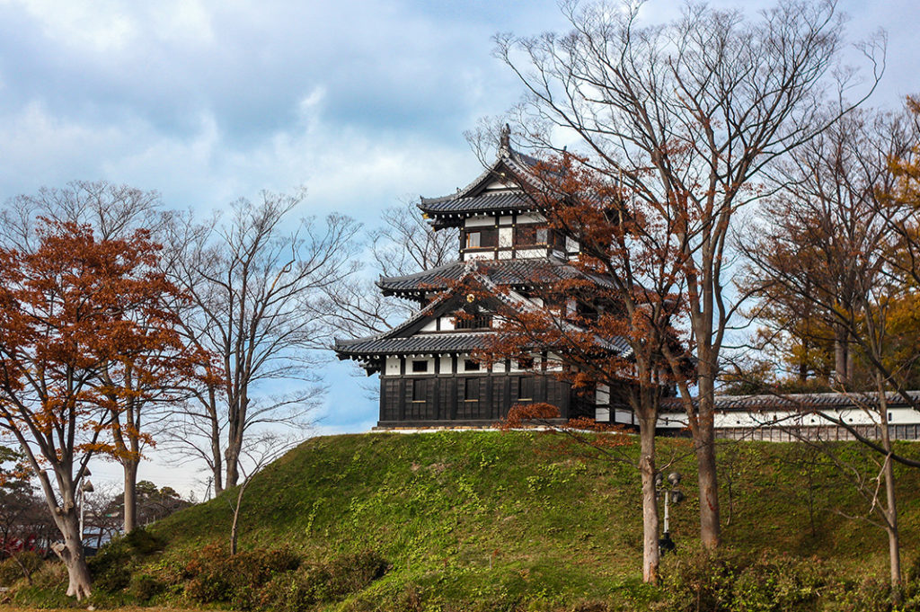 The reconstructed triple turrets of the yugara corner tower, upon the earthen wall at Takada Castle, Niigata, Japan.  