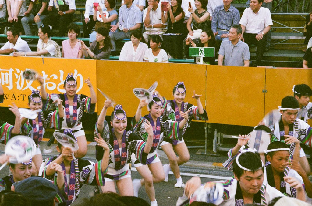 Young women and teen boys dance the men's dance at Awa Odori