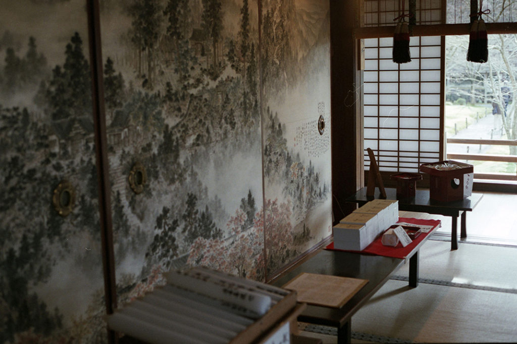Painted walls and soft light inside the main hall of Ohara Sanzen-in.