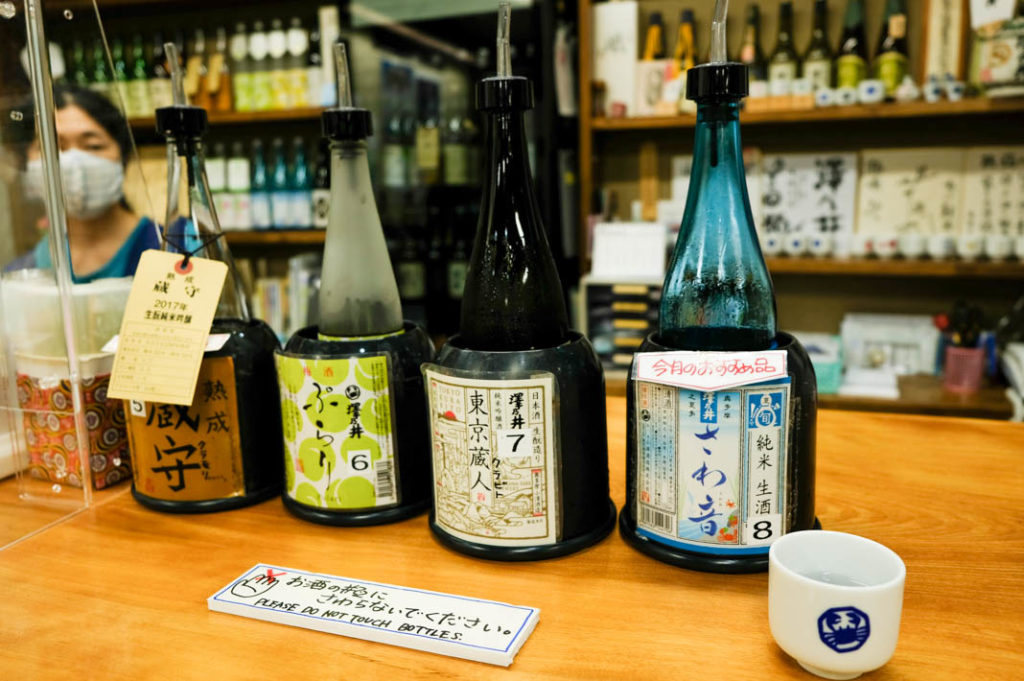Sipping sakes at the sake tasting room at Sawanoi Sake Brewery. 
