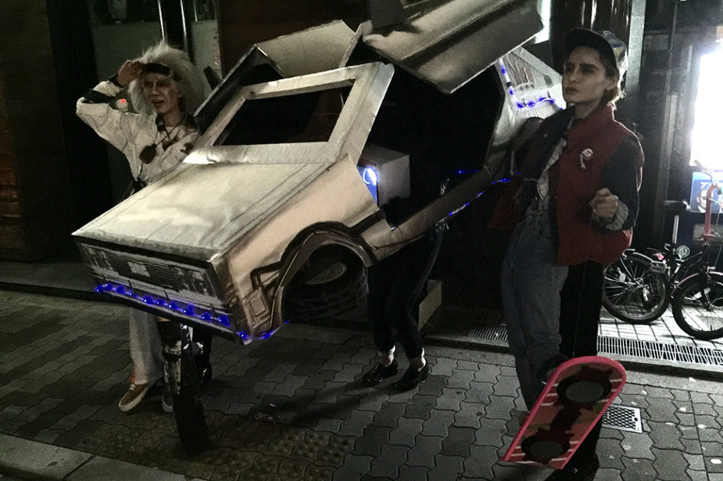 Three people are dressed as characters from Back to the Future at a Japanese Halloween event in Osaka, Japan. 5 points!