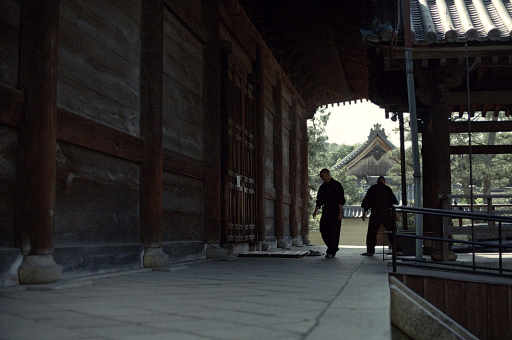 Myoshin-ji's resident monks work around the temple, cleaning and repairing the premises.
