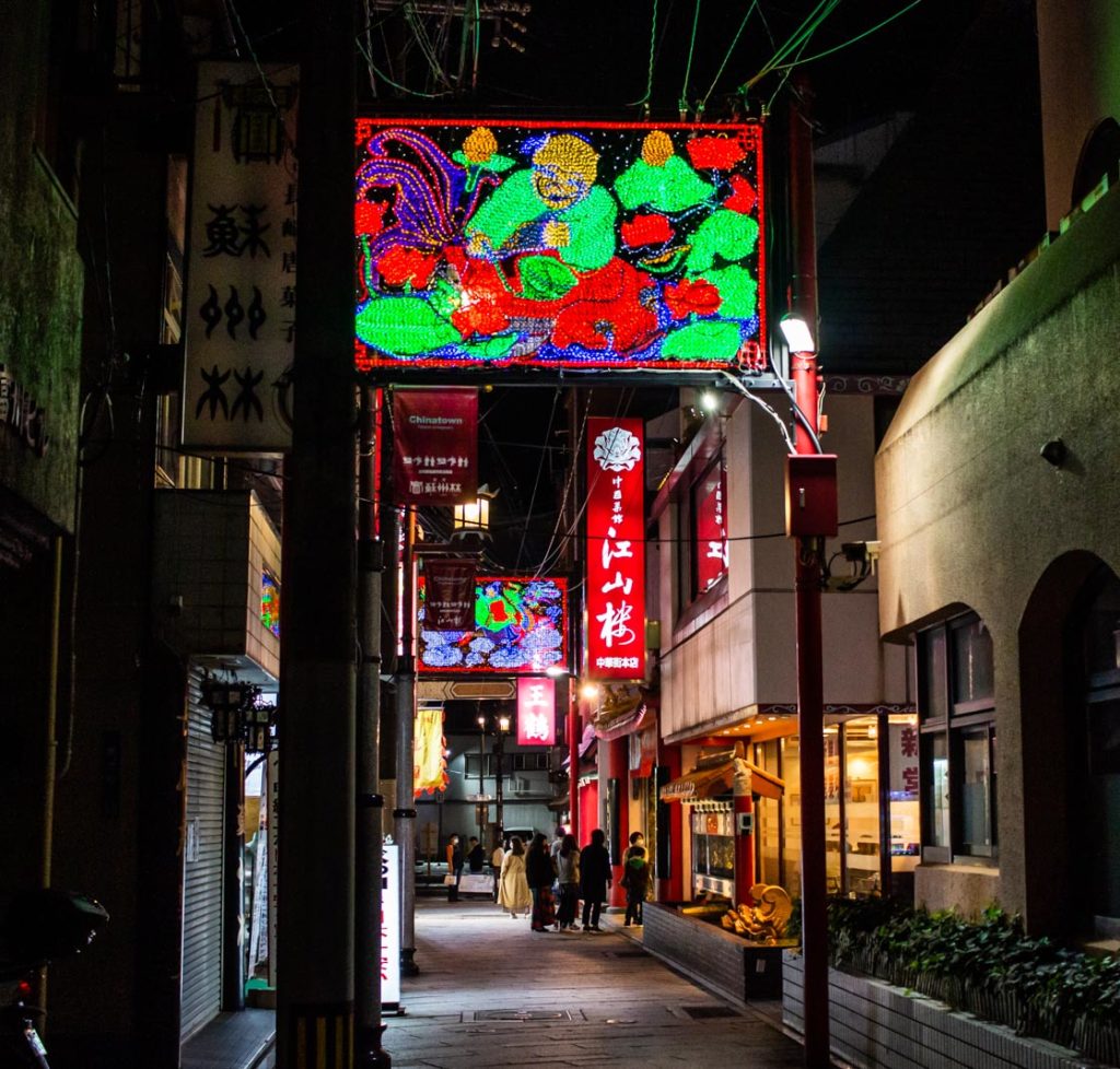 People looking at Chinese restaurants in Nagasaki Chinatown