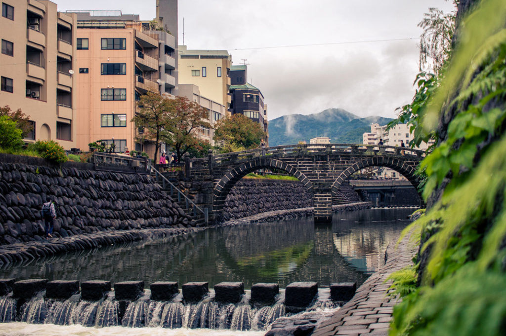 Meganebashi stone bridge is said to be one of the oldest in Japan. Its double arch design led to the nickname 'Spectacles Bridge'.