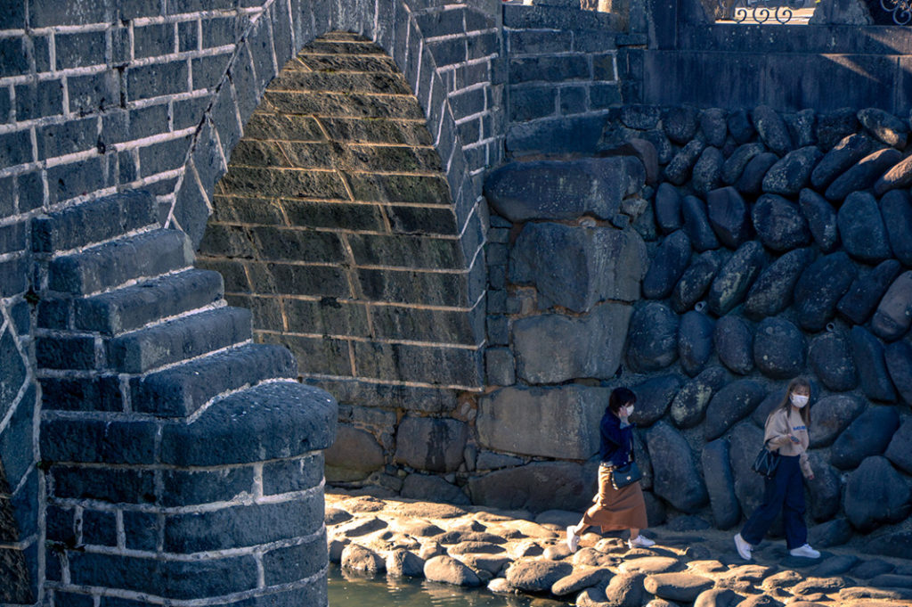 Meganebashi stone bridge is said to be one of the oldest in Japan. Its double arch design led to the nickname 'Spectacles Bridge'.