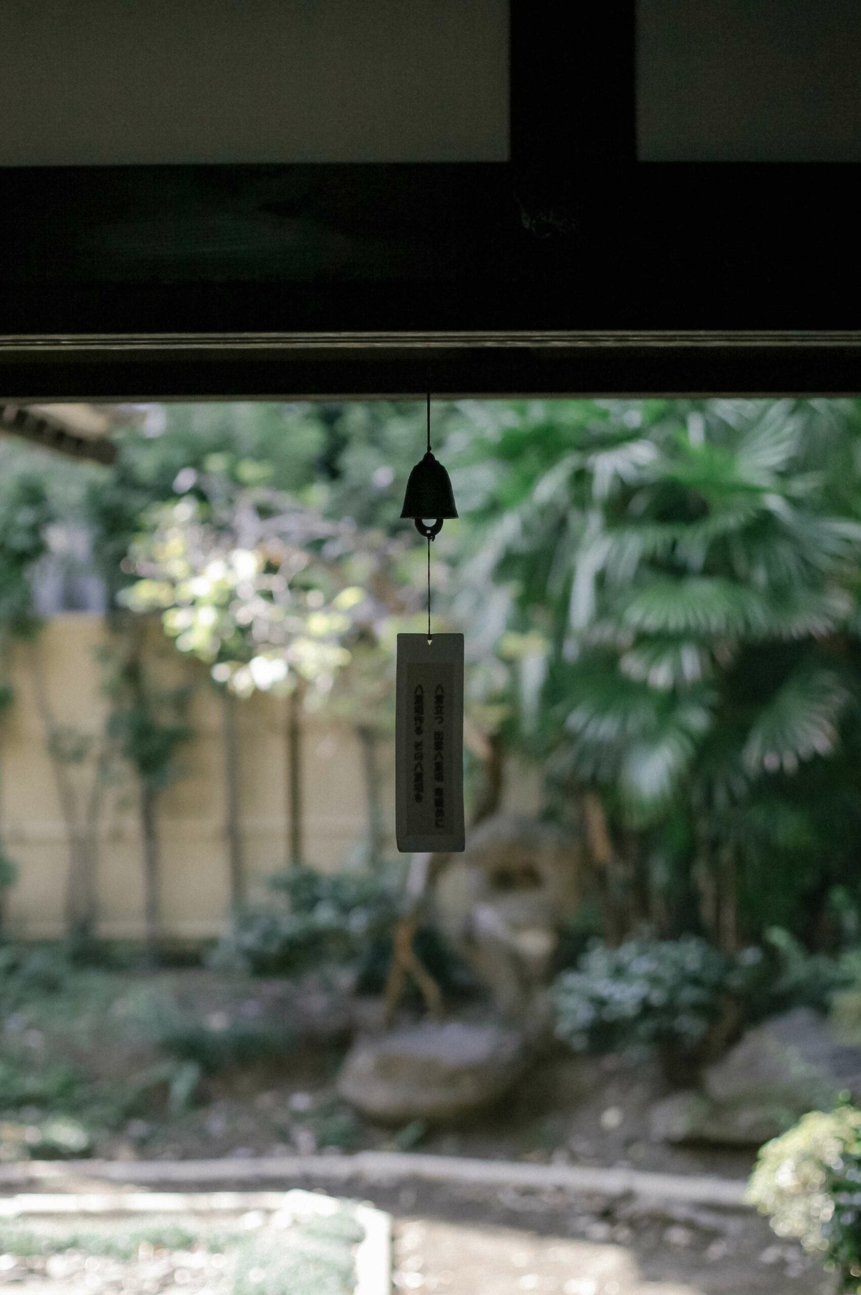 Homely details include wind chimes and garden views.