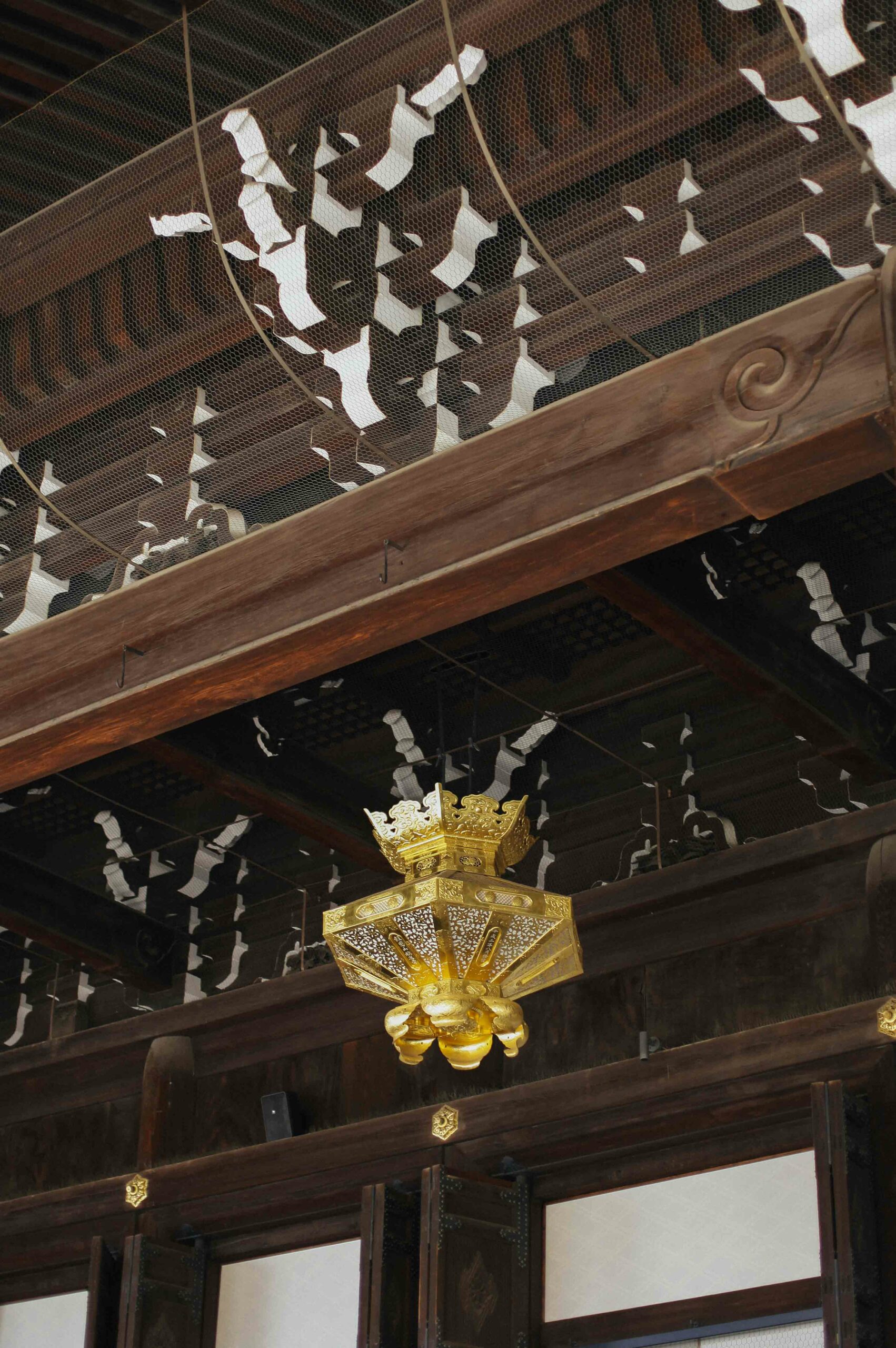 Golden lanterns hang from the eaves of Nishi Hongan-ji.