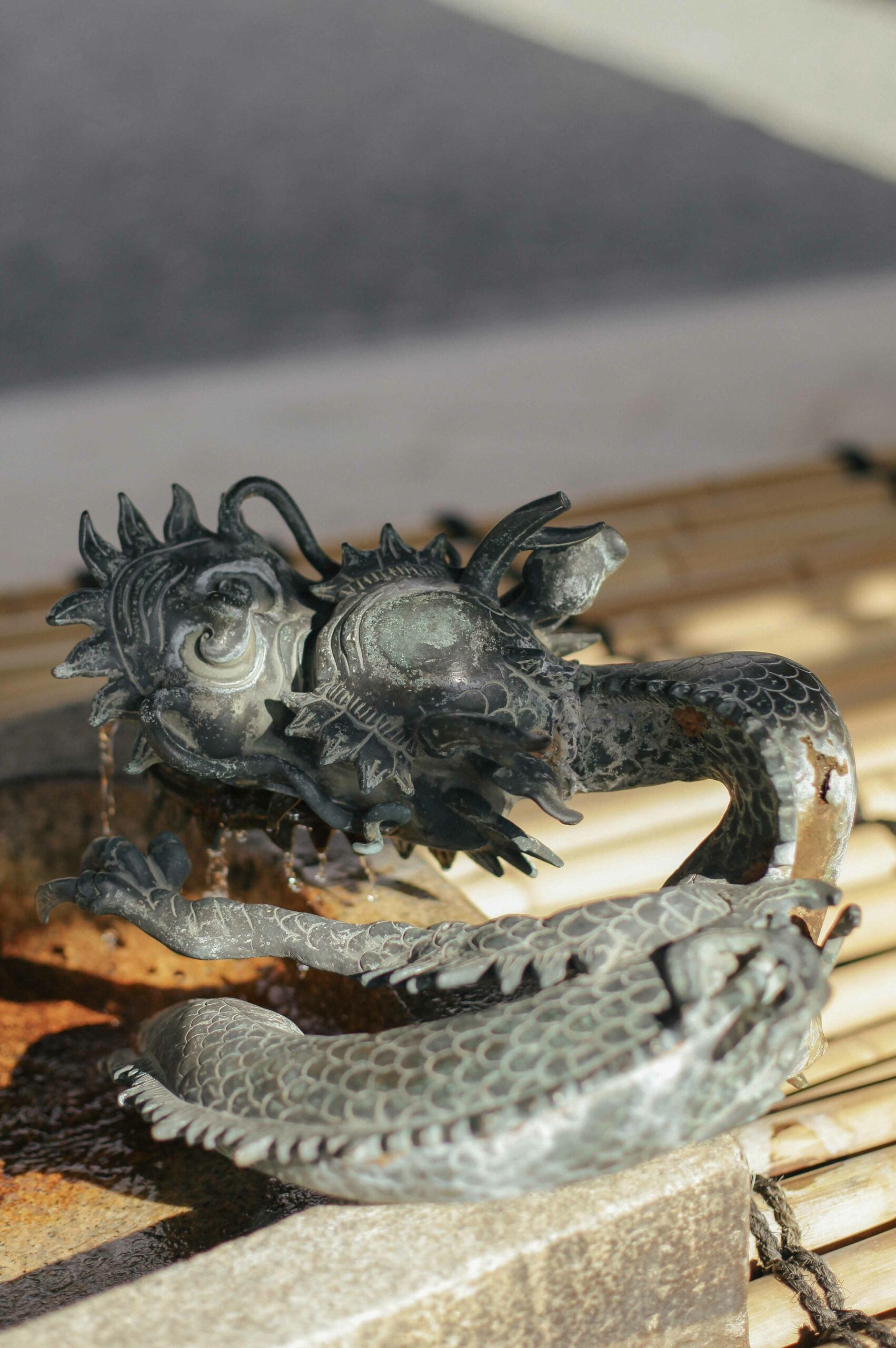 The temple courtyard at Nishi Hongan-ji is home to a cleansing basin guarded by a bearded dragon.