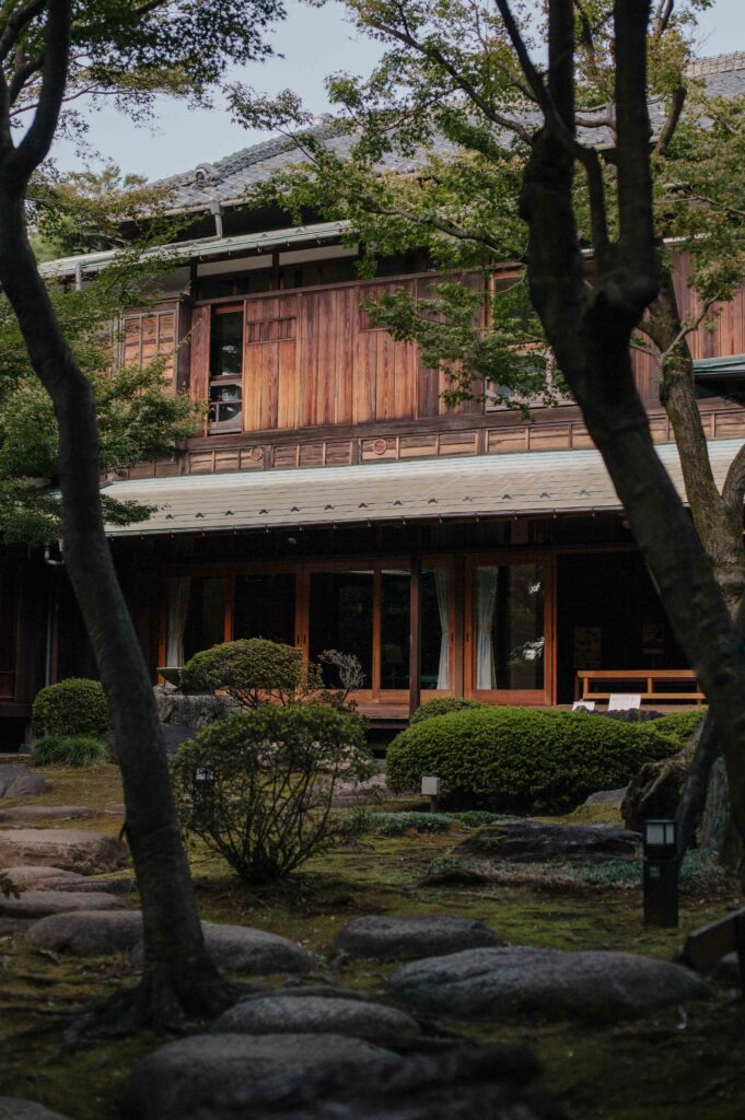 Kyu Asakura house is a warm-toned wooden building in its own tiny forest, in the middle of Shibuya.