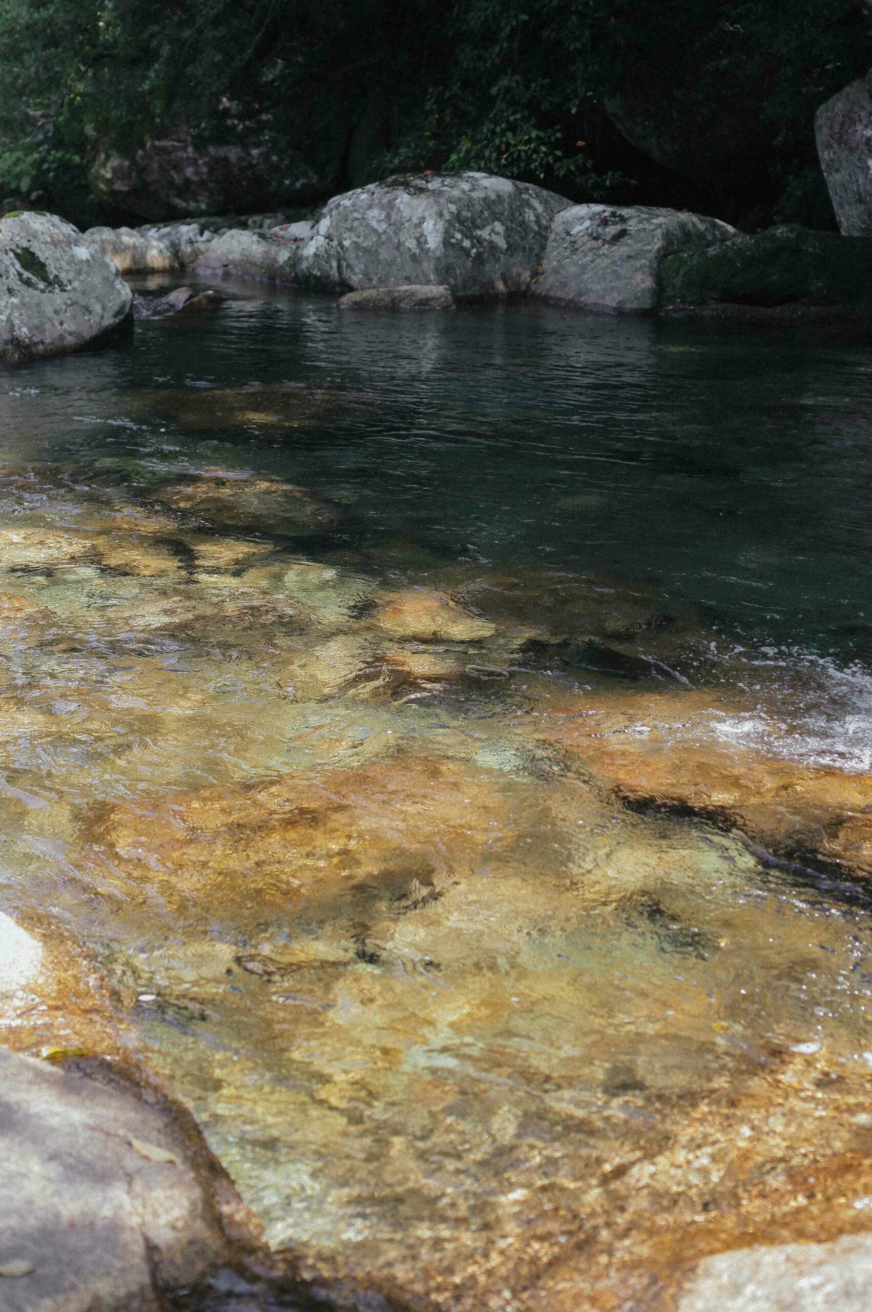 Pools of clear water swirl through the ravine at Shiratani Unsuikyo.