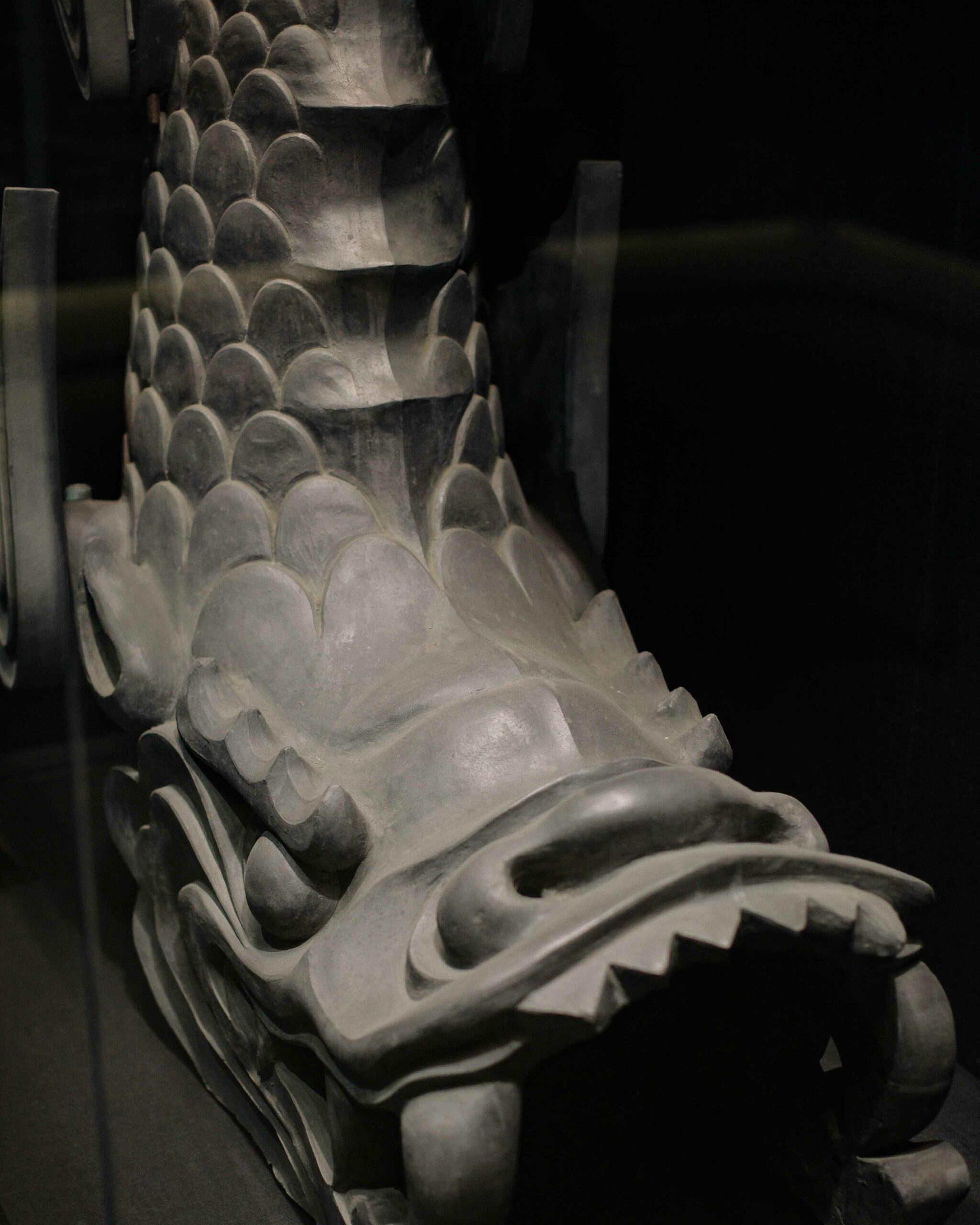 Roof tile and 'shachihoko' displays inside the museum.